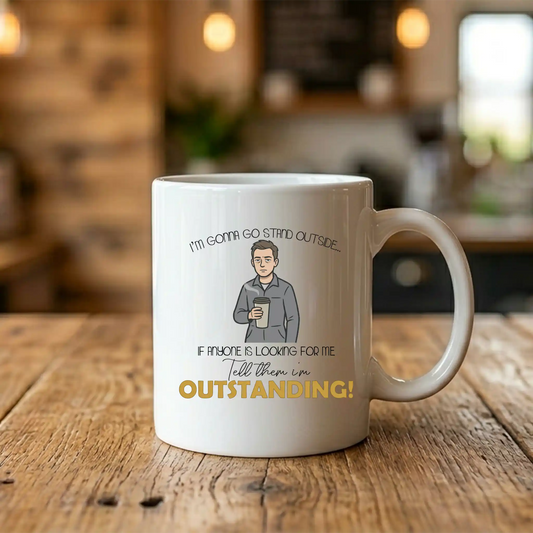 11oz white ceramic coffee mug with a flat bottom, featuring a funny illustration of a groggy male character in coveralls with the text Outstanding