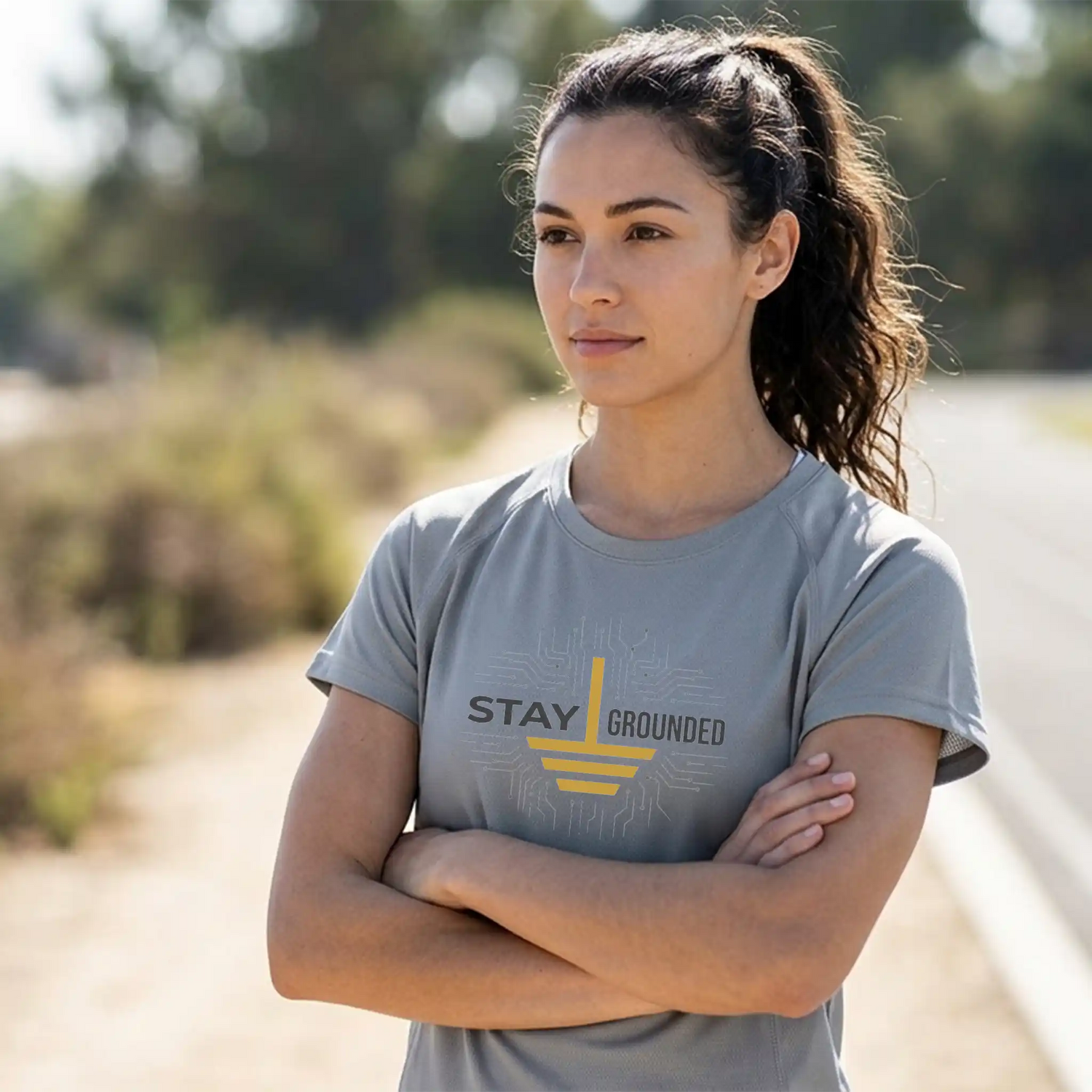Woman wearing a t-shirt that reads: Stay Grounded.