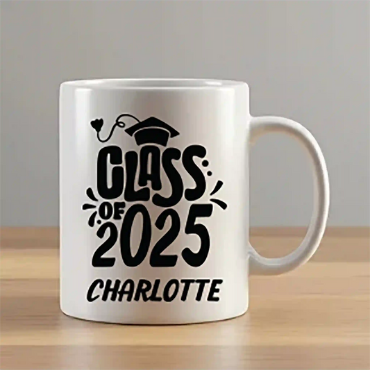 Personalized white ceramic coffee mug featuring the text "Class of 2025" in bold graduation-themed font with the custom name "Charlotte" printed underneath. Graduation gift mug for high school or college students.
