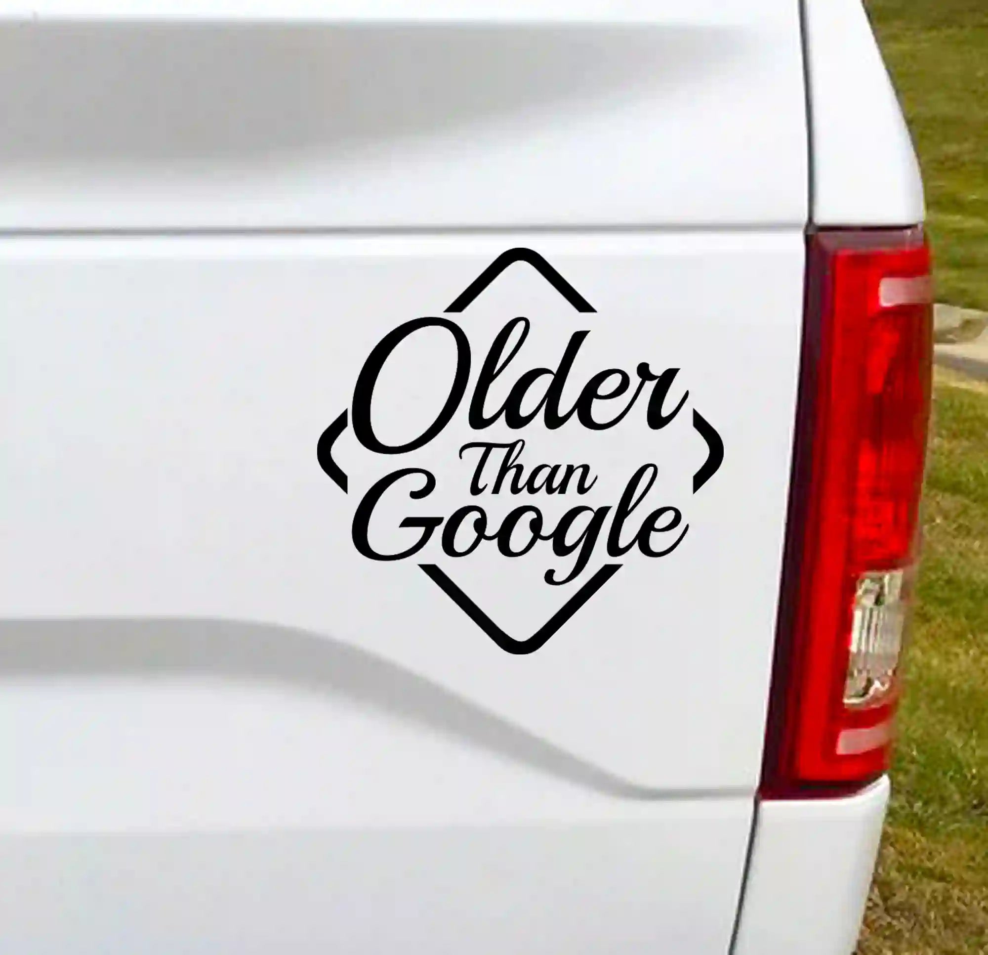 "Older Than Google" black vinyl decal on white truck tailgate | Humorous pickup truck sticker | Automotive graphic
