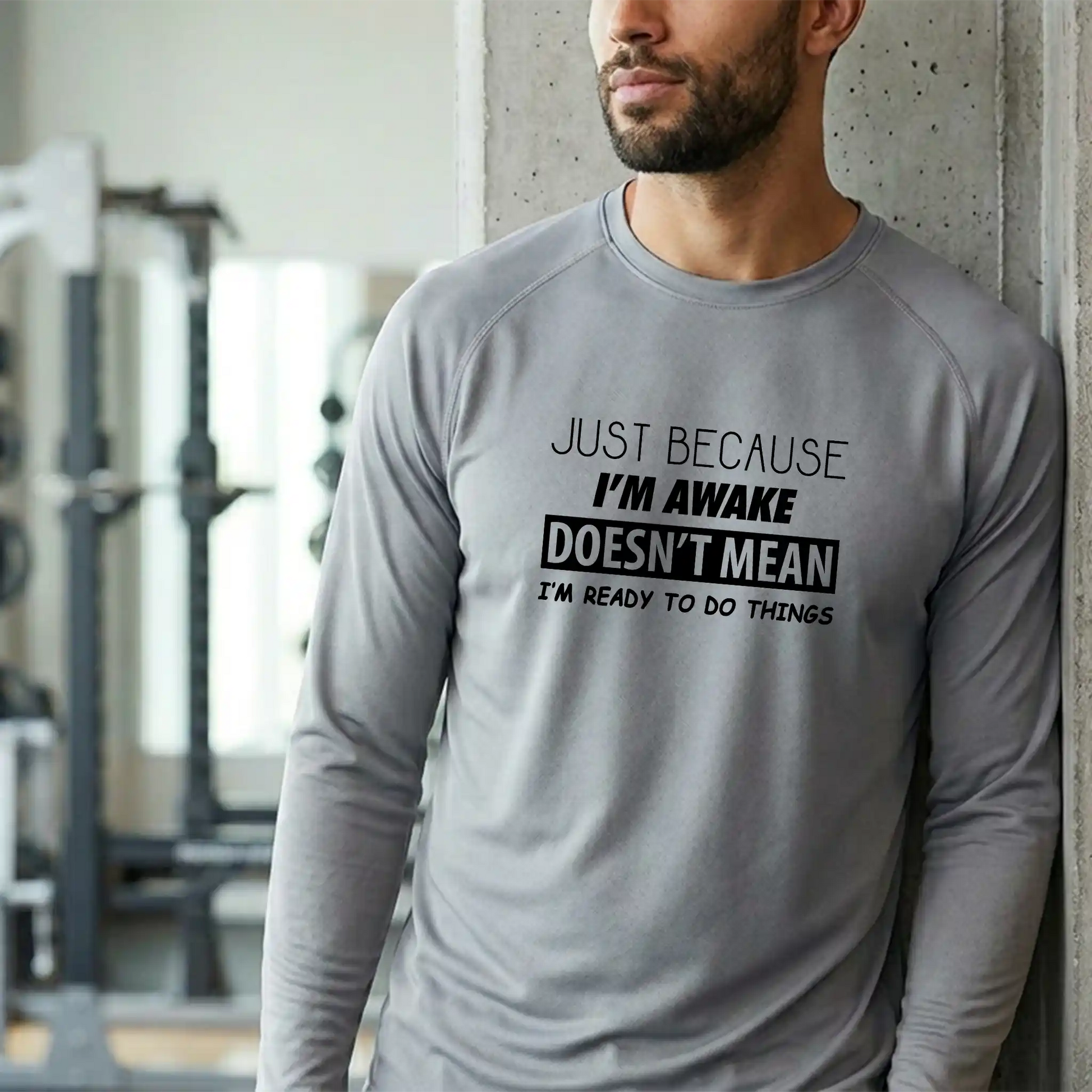 Male model in a long-sleeve Platinum moisture-wicking performance tee - Professional grade graphic apparel finished in Mount Pearl.