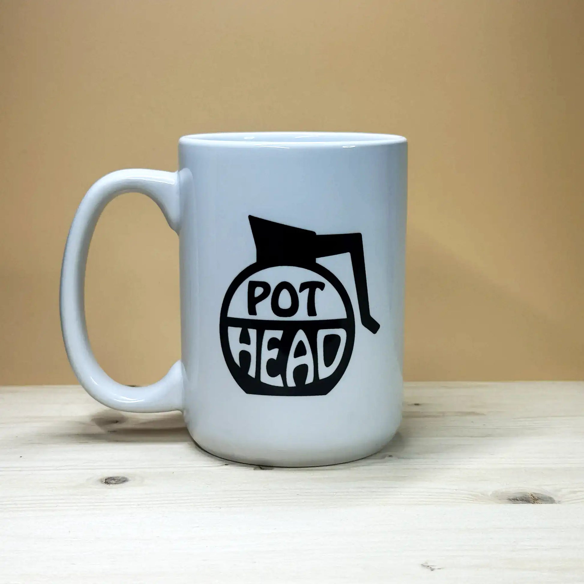 Angled view of a Pothead pun mug with a large comfortable handle, perfect for coffee lovers and office humor.