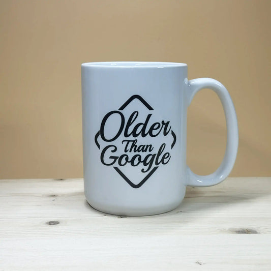 Vintage 1990s milestone 15oz coffee cup celebrating being established before 1998.