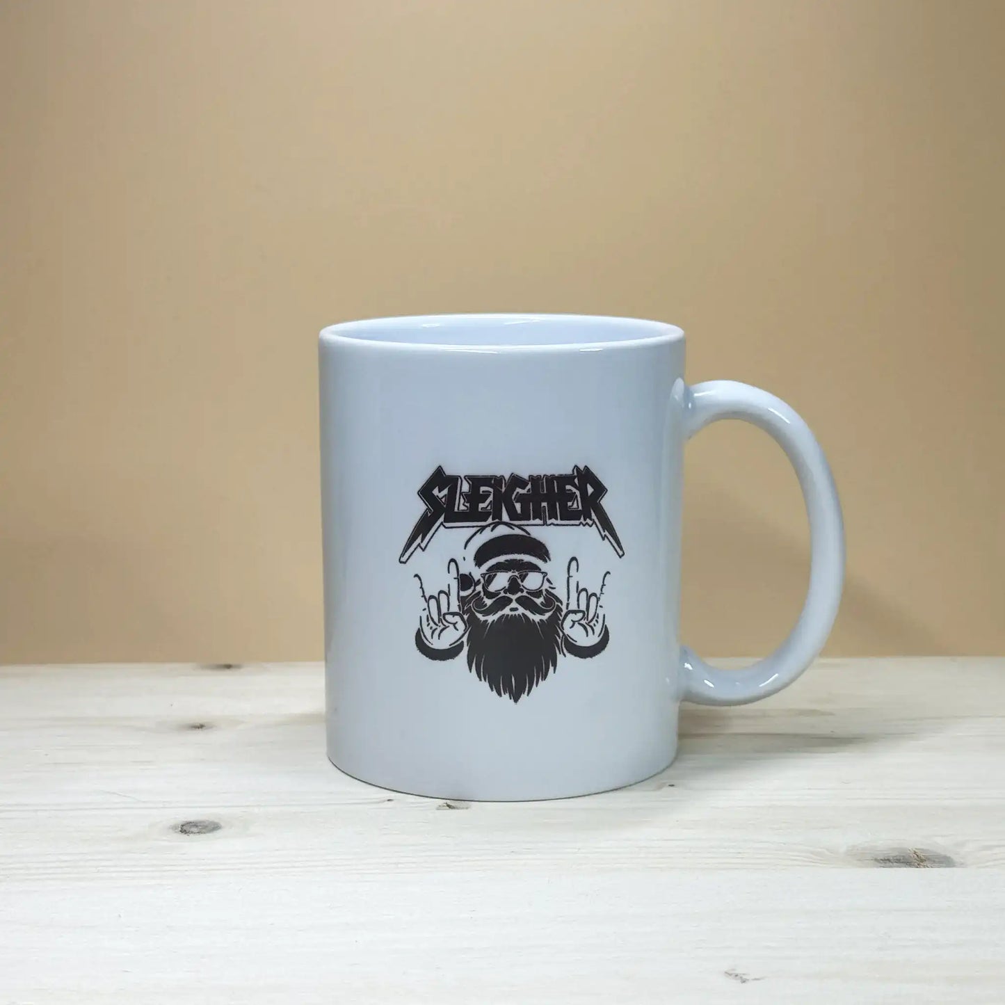 Funny heavy metal holiday coffee cup 11oz with black and white rock santa illustration.