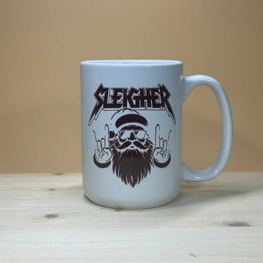 Heavy metal Santa Claus parody 15oz mug with Slayer band logo style Christmas graphic.