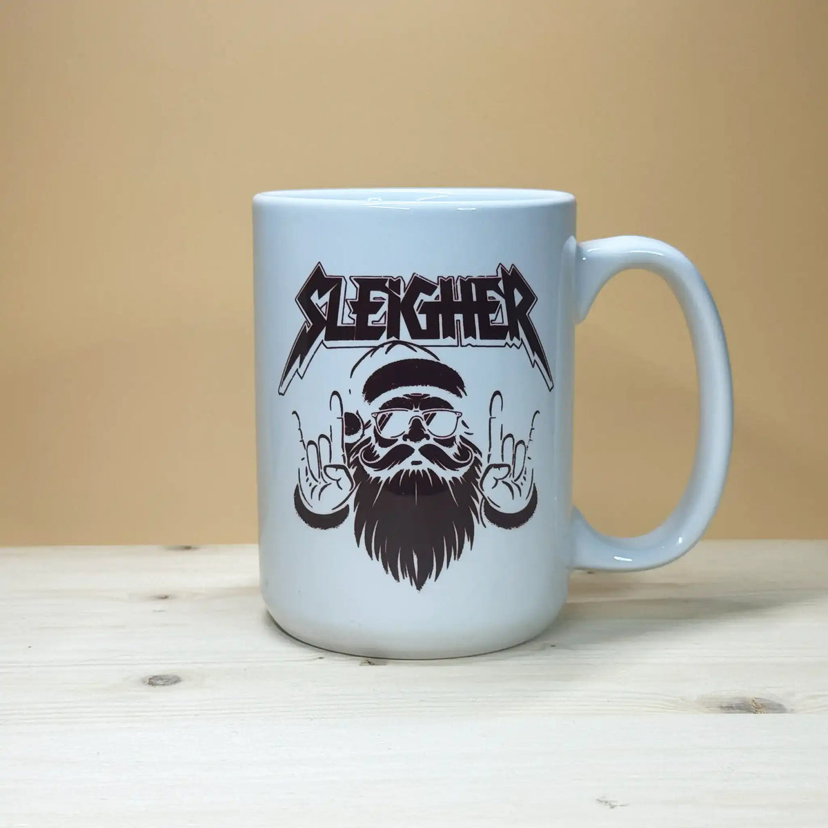 Heavy metal Santa Claus parody 15oz mug with Slayer band logo style Christmas graphic.