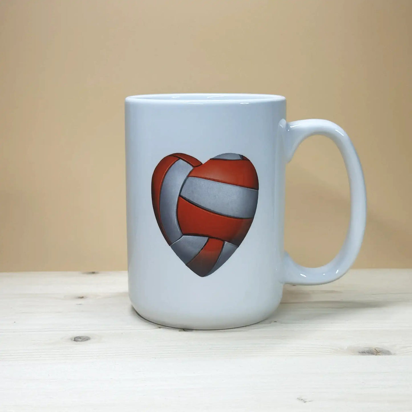 Large 15oz ceramic volleyball mug with red and white heart graphic for post-game handshake line humor.