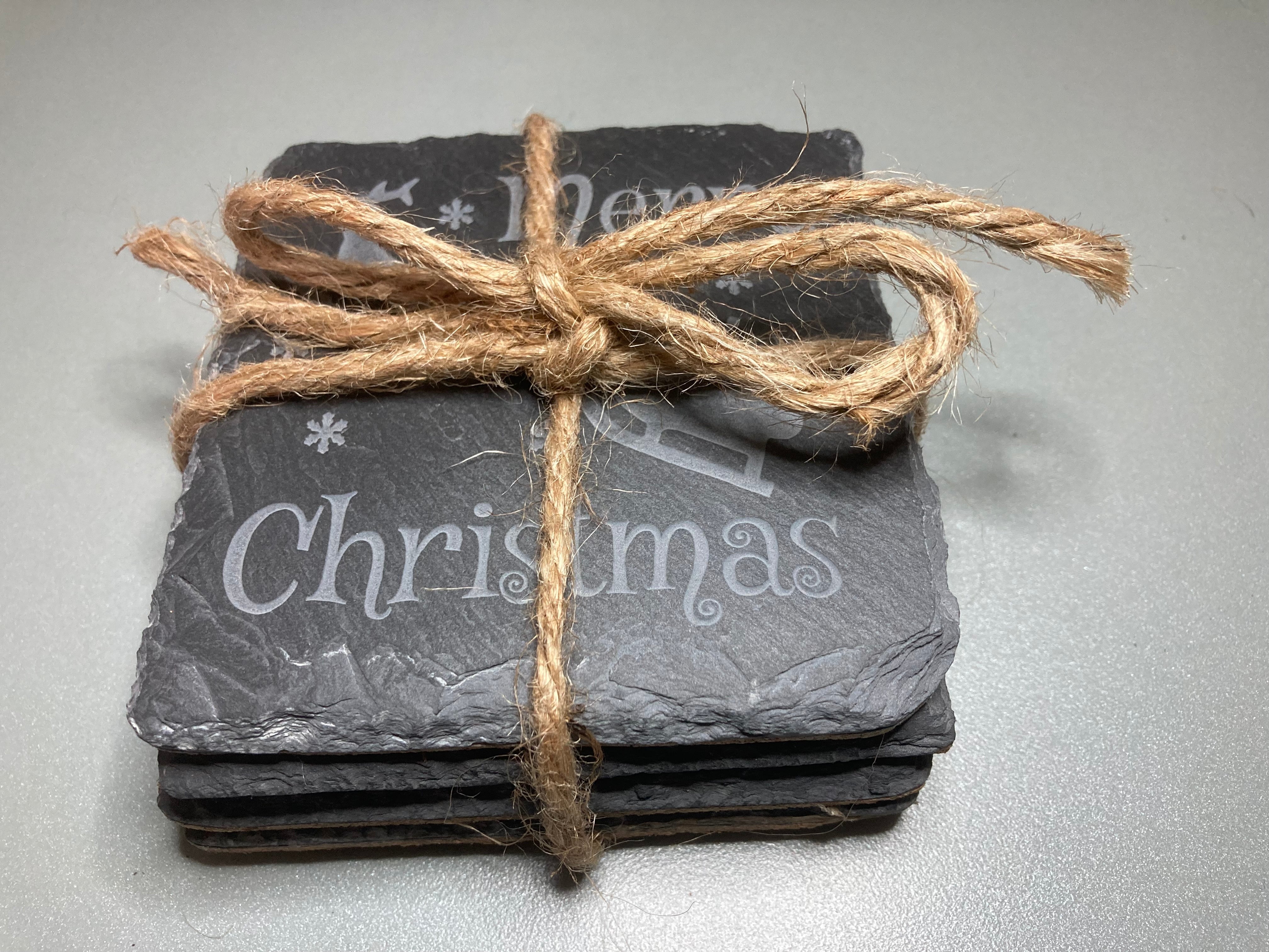 Merry Christmas Coaster. A great gift for the holidays. Get a set for entertaining guests. Carved to a depth and quality that cannot be achieved with simple engraving. Buy as a single, or mix and match in sets of 2 or 4. Add a Coaster Holder and/or Gift Box. Each sold separately.